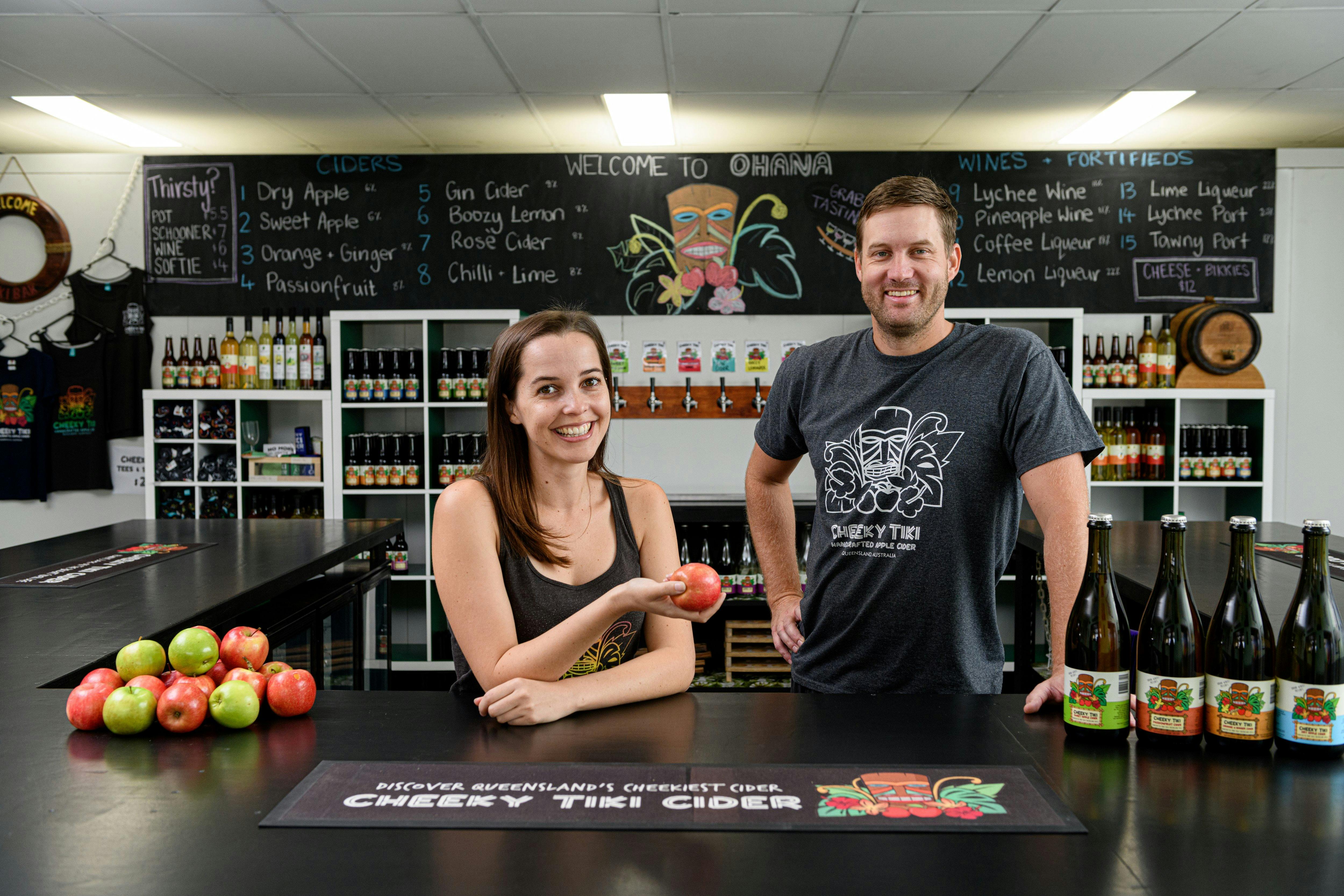 Owners Zoe and Josh standing behind the bar