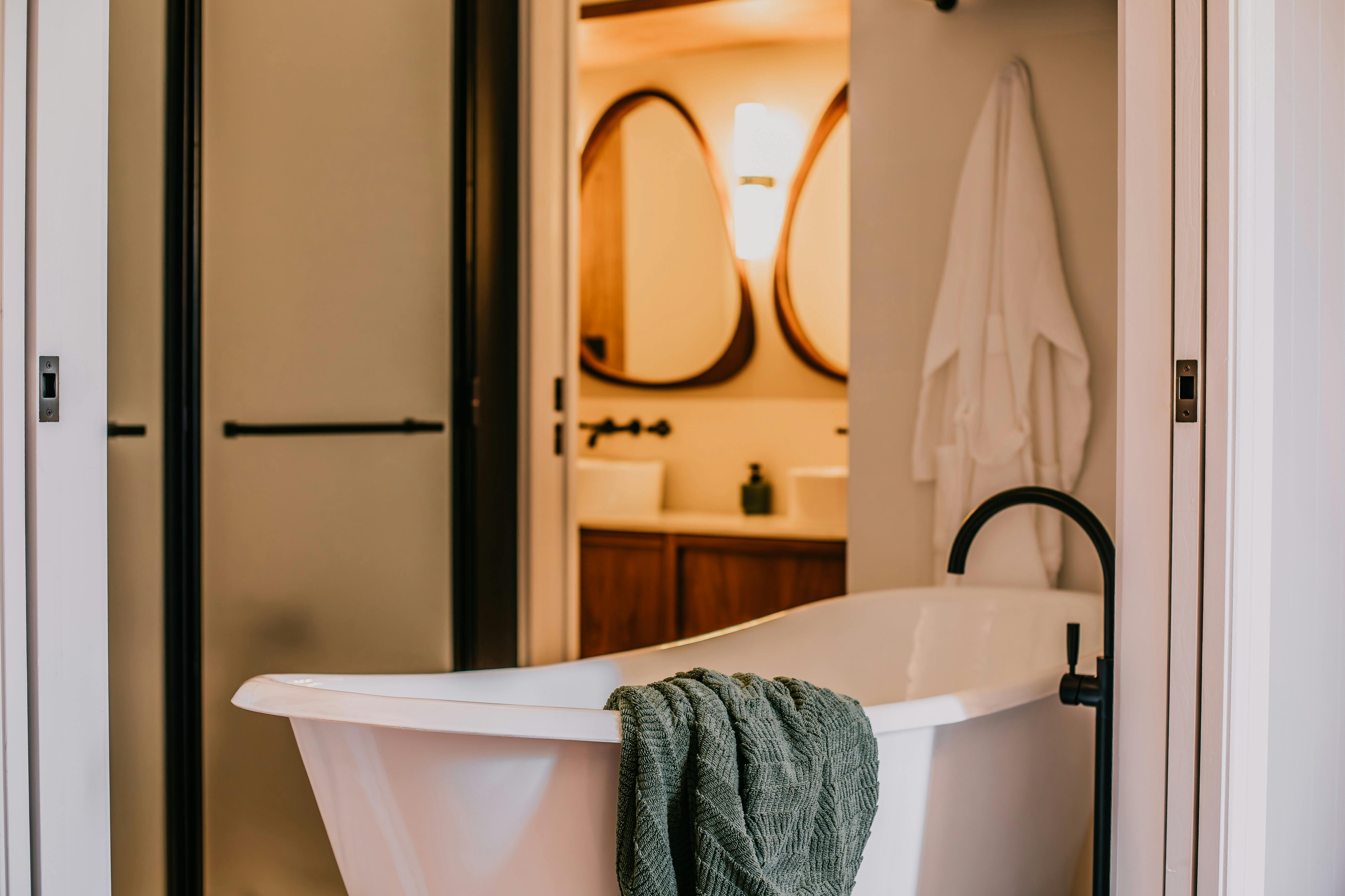 Superb private ensuites featuring iron bathtubs, walk in showers and spa amenities