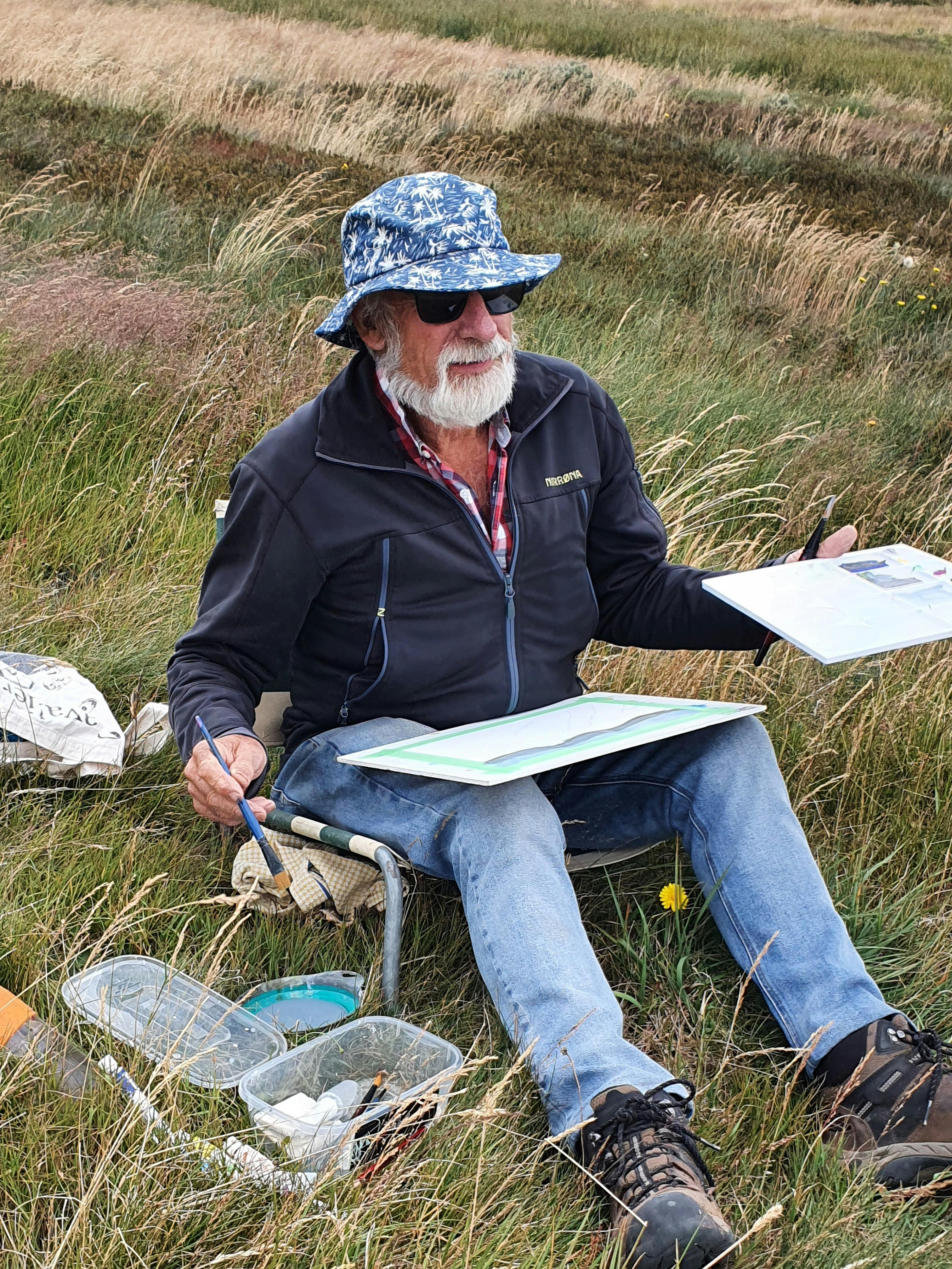 A man learns to paint the view in Wendy Jagger Studio's workshop.