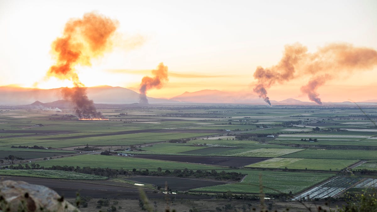 View of cane fires in the distance from the Mt Inkerman Lookout
