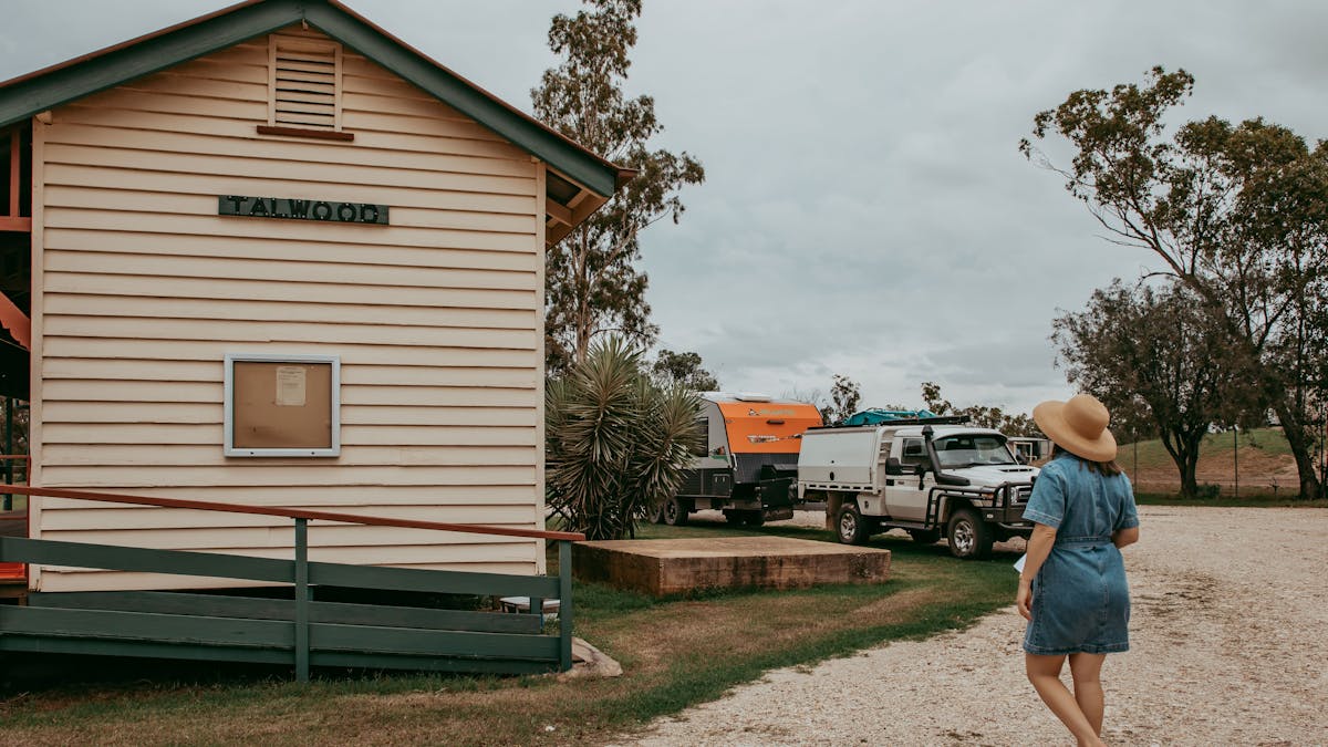 Woman walking to the Talwood Recreation Grounds building