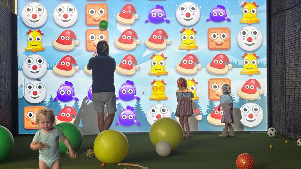 Family game night at interactive sports games at MultiMatch Cleveland in Cleveland Queensland.