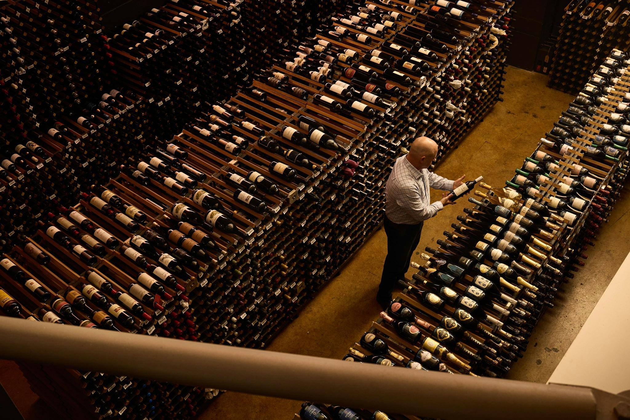 sommelier in wine cellar