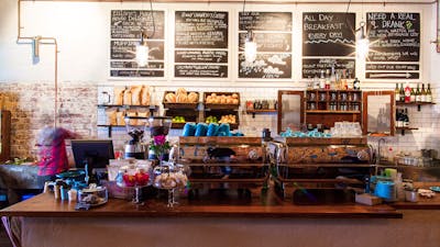 Cafe counter with fresh bread and blackboard menus