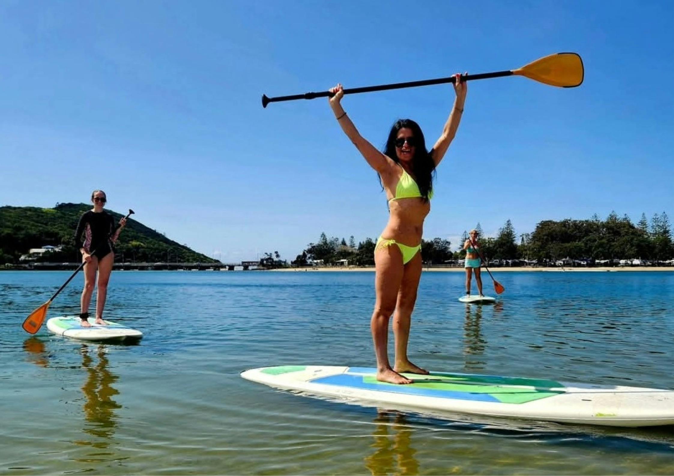 SUP Ladies having a wonderful experience, enjoying their paddle boarding at Tallebudgera Creek.