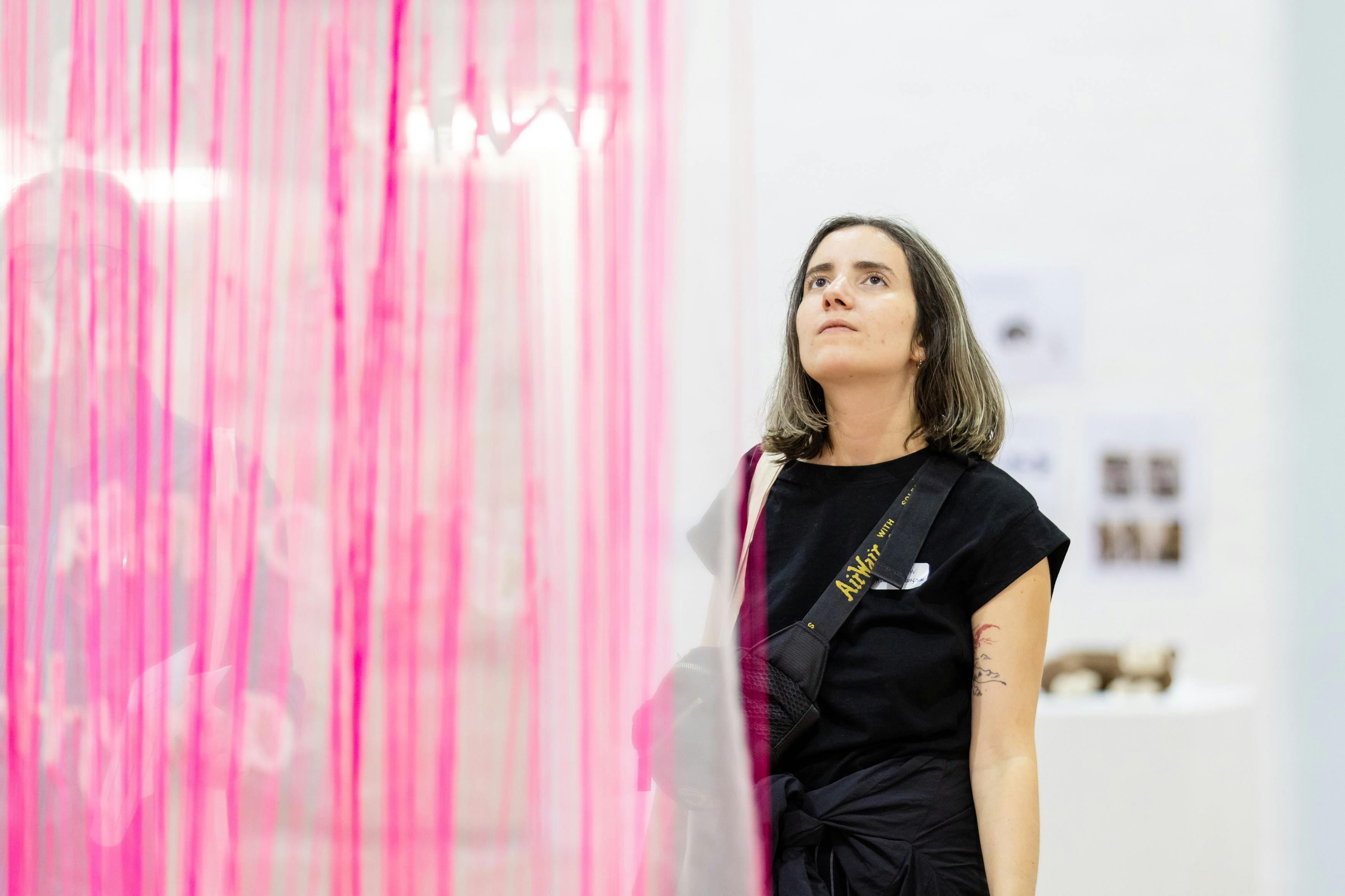 Student looking at the graduating exhibition