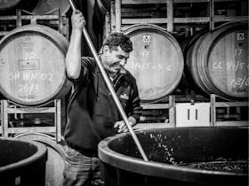 Nick Zema plunging red wine at Zema Estate in Coonawarra