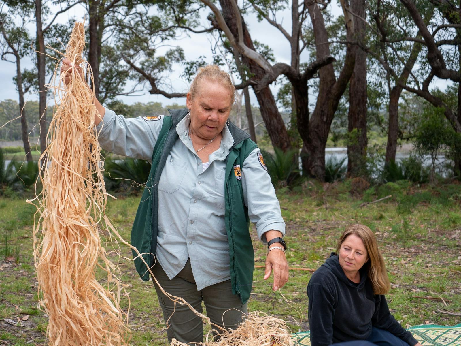Aboriginal guide demontrating weaving techniques.