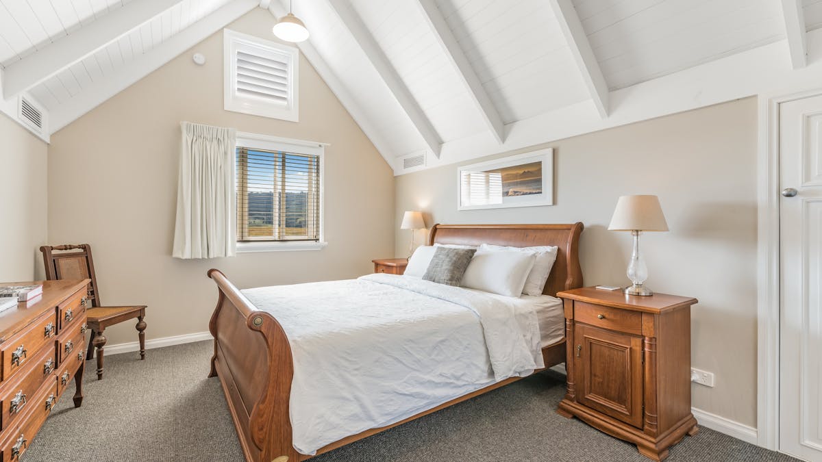 Timber bedroom sleigh bed soft colours