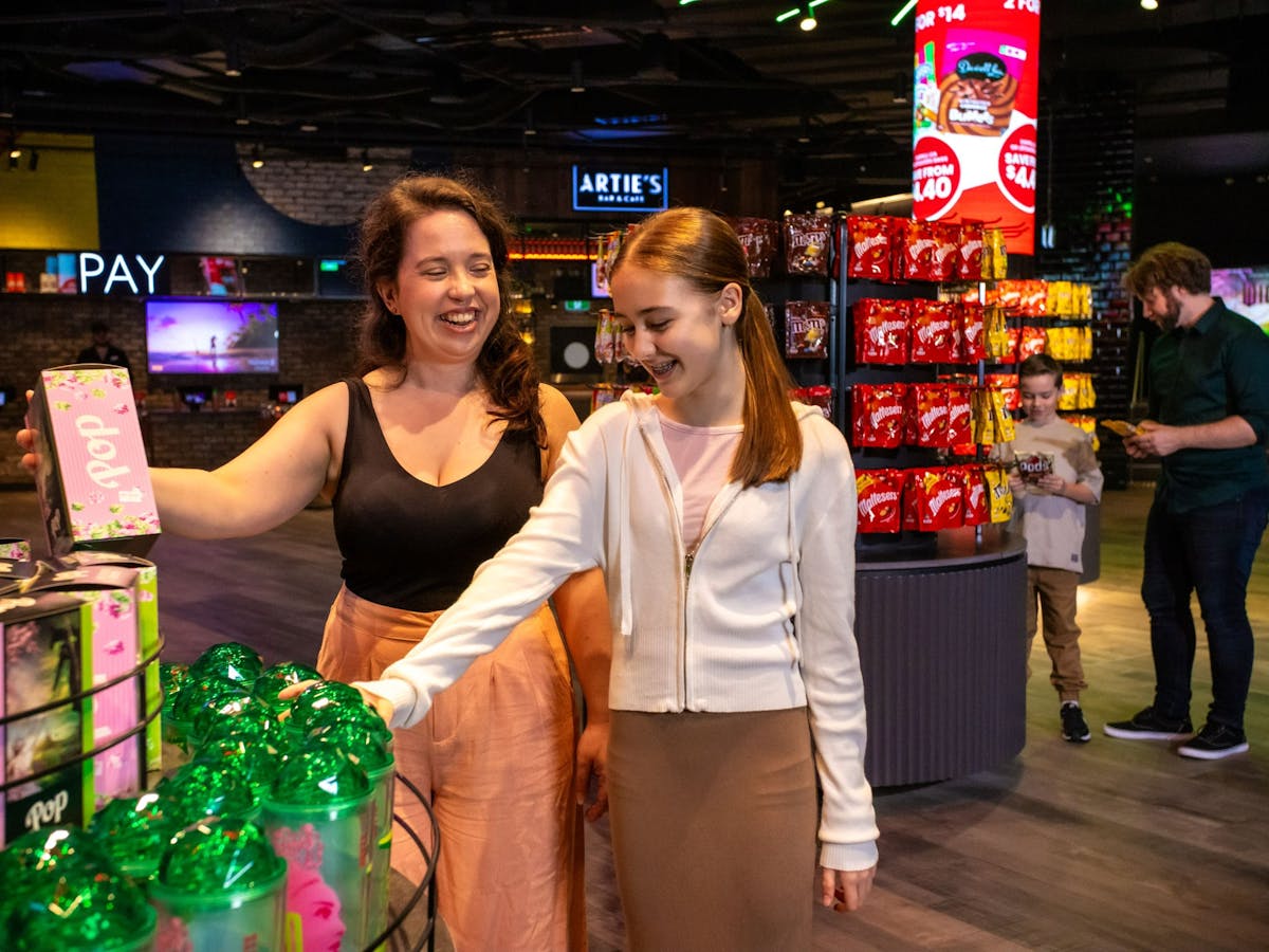 People selecting snacks at the cinema