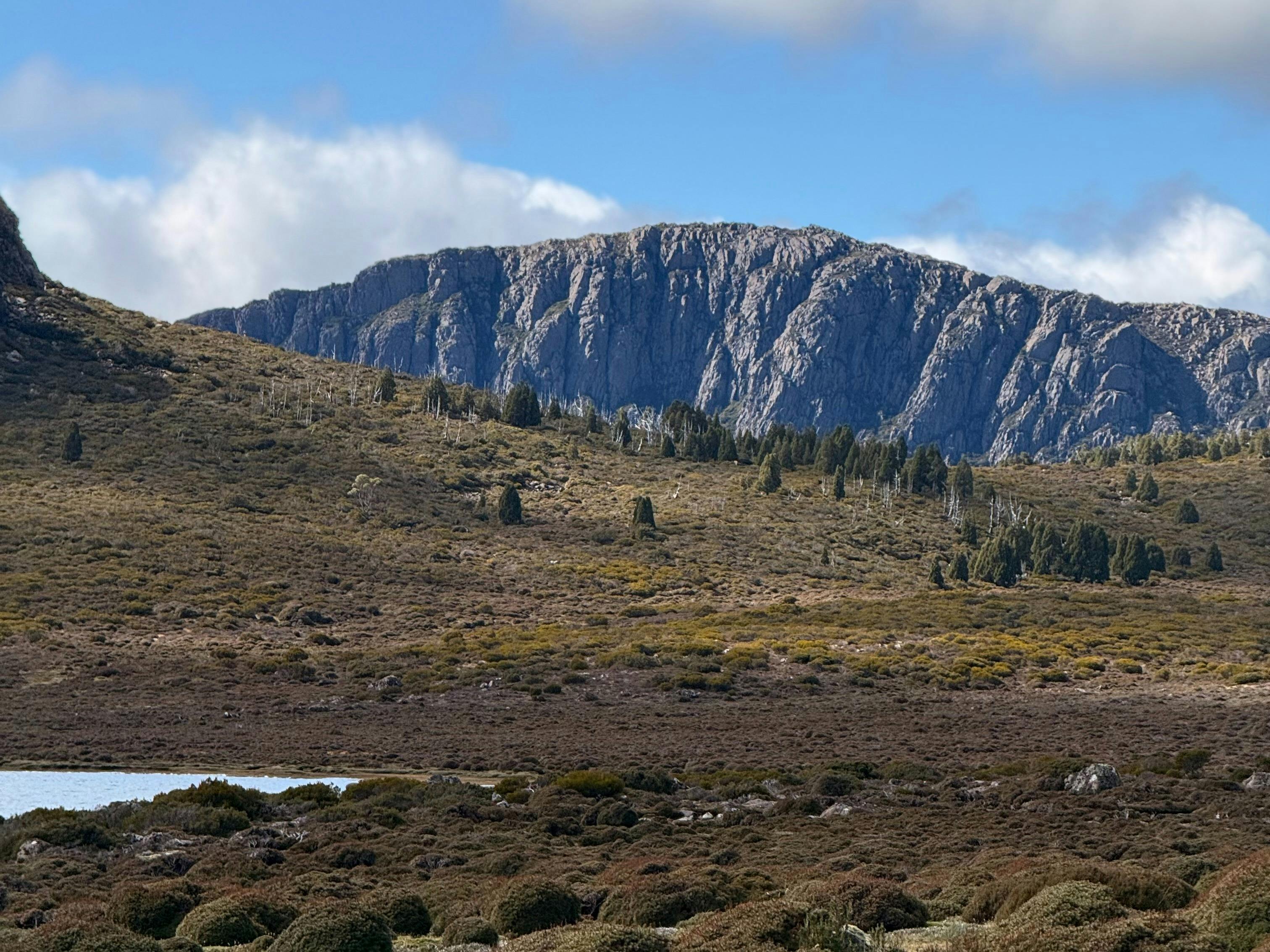 Dolarite cliffs and sparkling tarns of The Walls