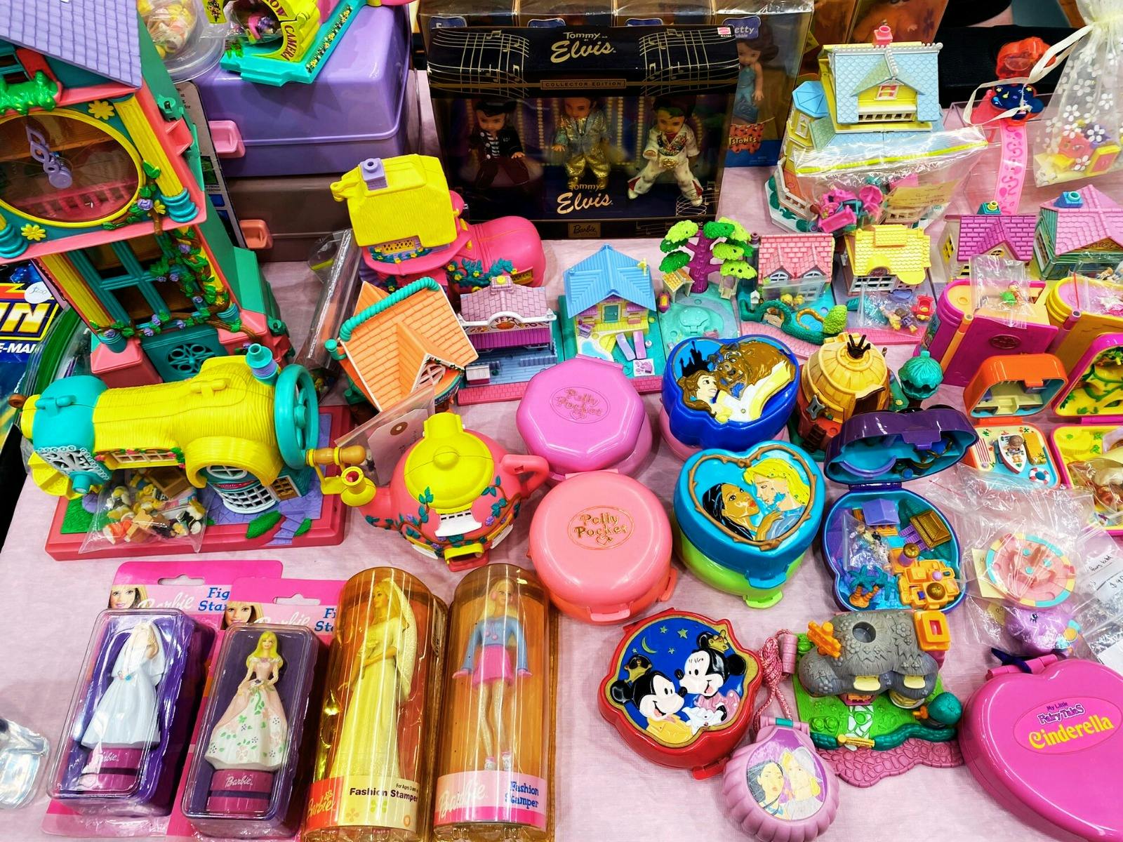 1990s Polly Pocket dolls on display on a vendor table