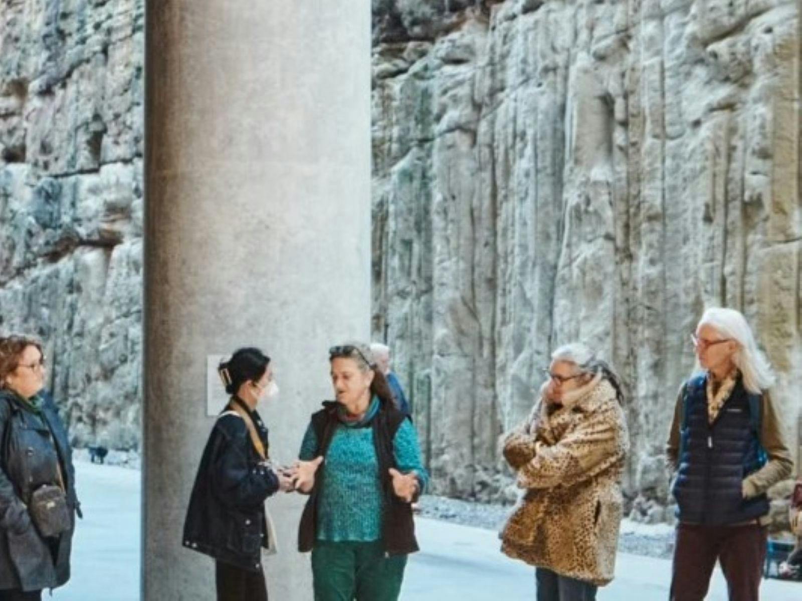 Auslan tour guide is signing to tour attendees