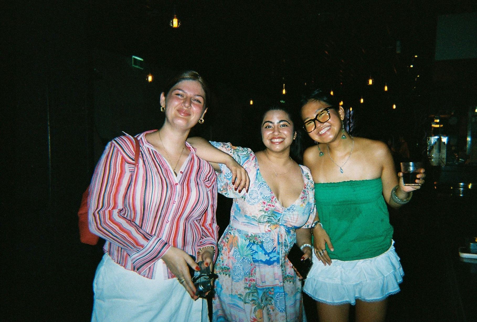 3 girls posing for a picture