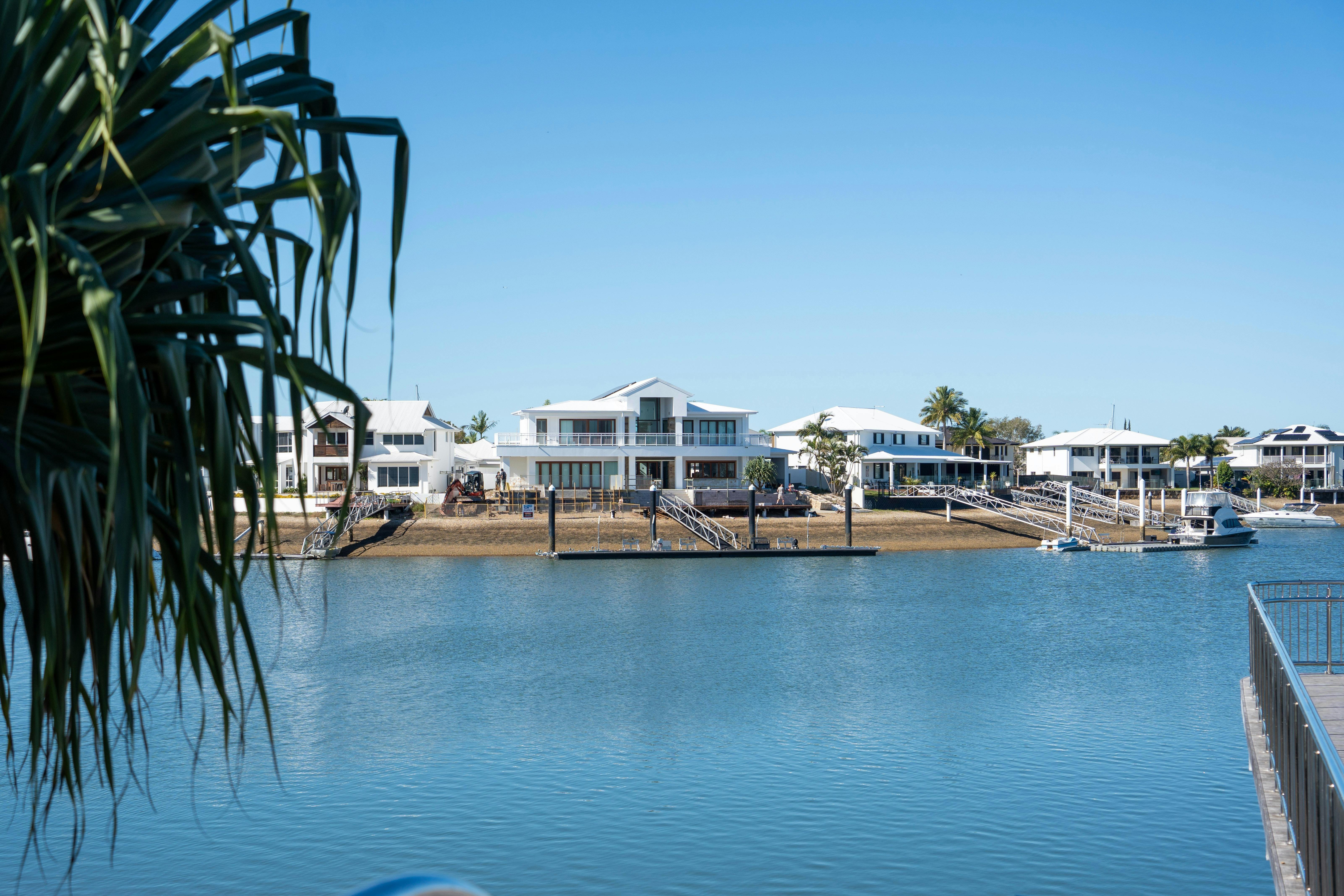 Waterfront homes, private jetties and boats along the Newport waterways.
