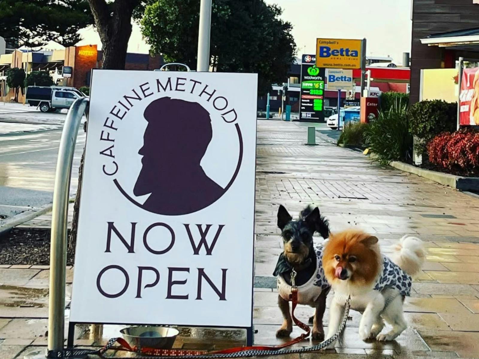 Cafe sign with dogs.