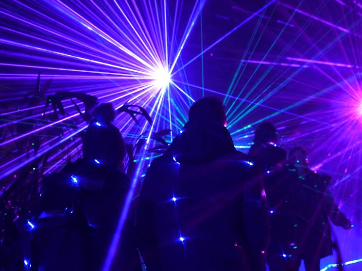 A group amongst blue starlight lasers