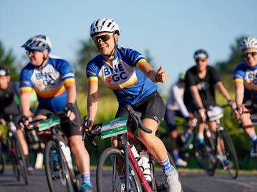 Group of cyclists riding on the road