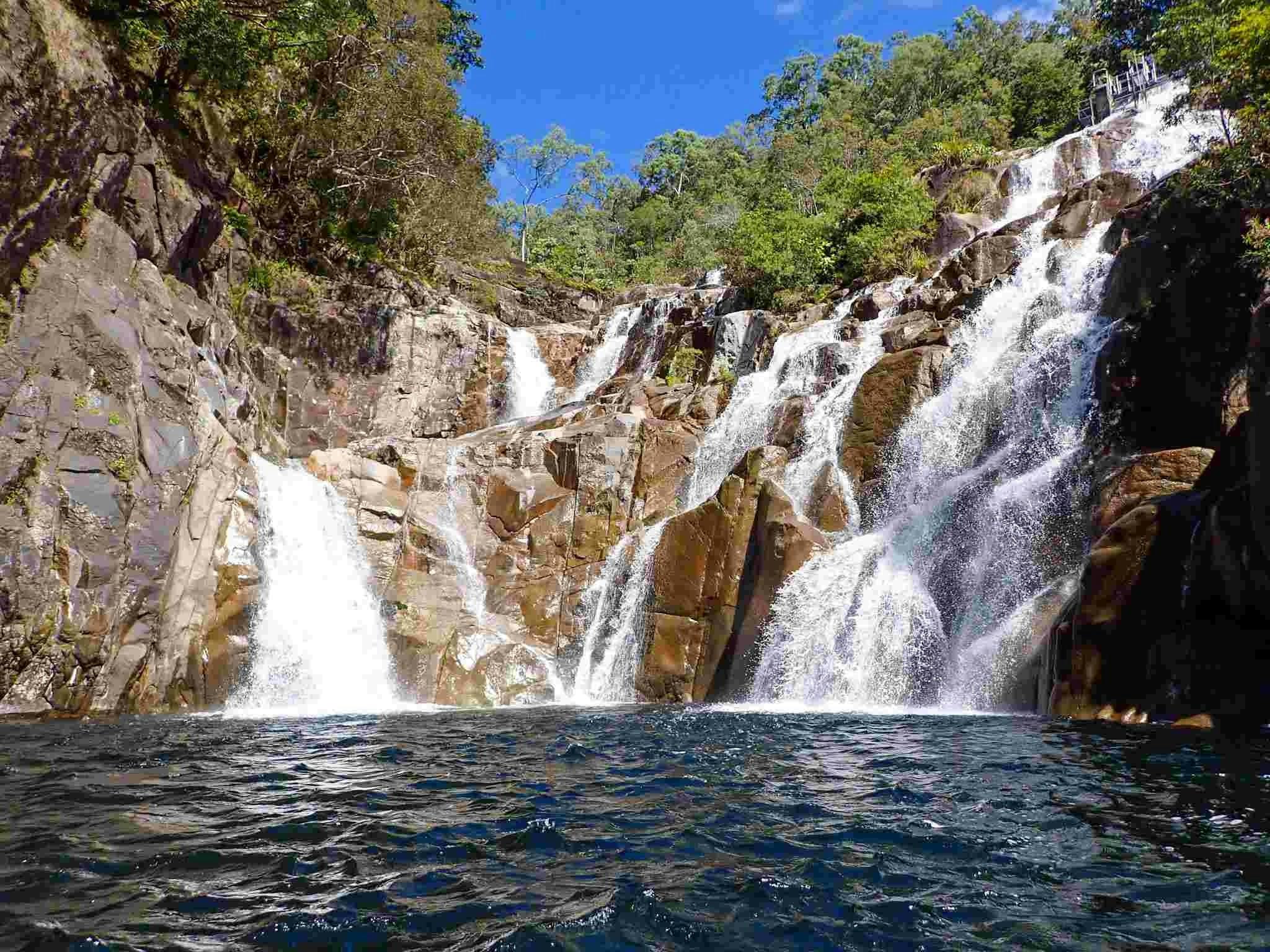 A waterfall in a forest A waterfall in a forest