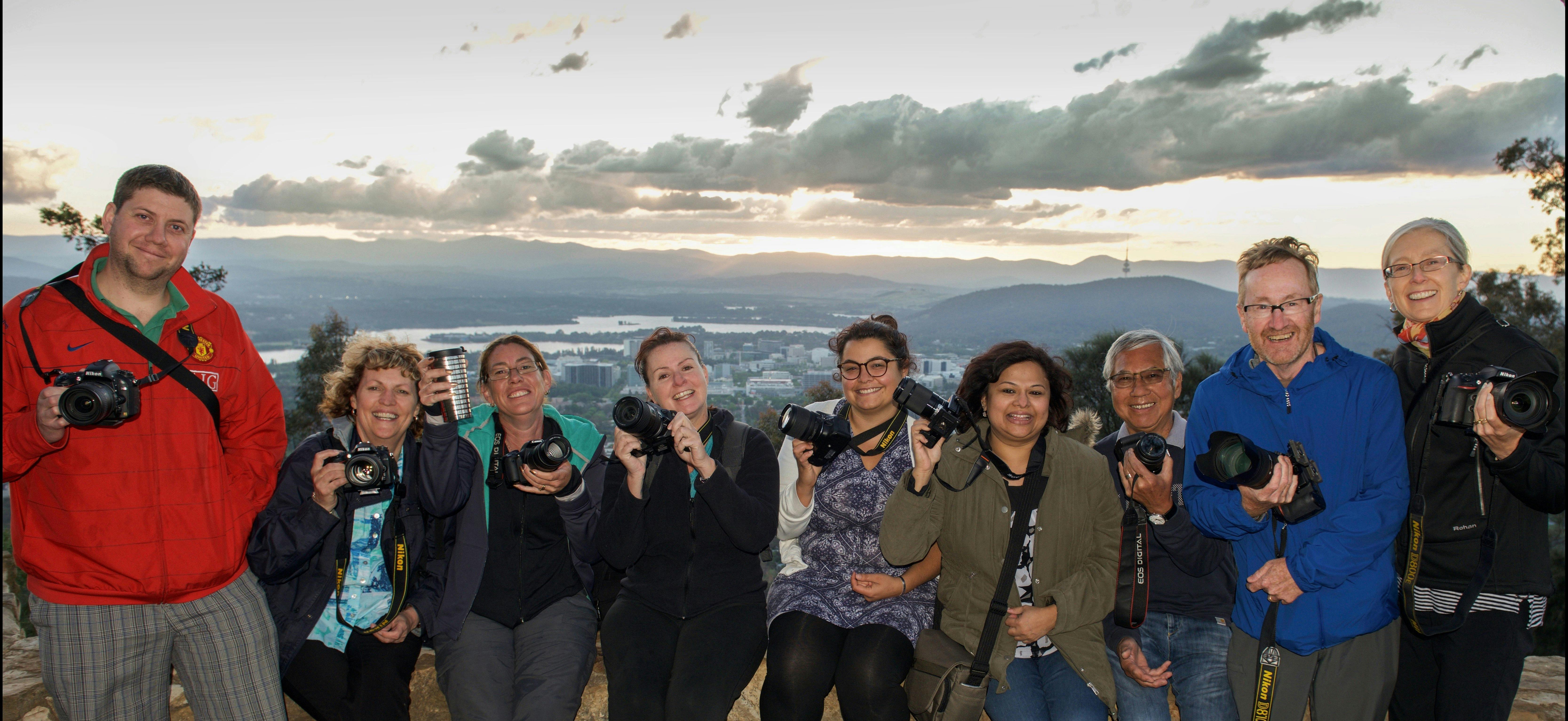 Smiling Capturing Canberra Photo group atop Mt Ainslie
