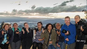 Smiling Capturing Canberra Photo group atop Mt Ainslie