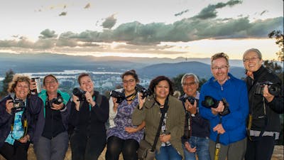 Smiling Capturing Canberra Photo group atop Mt Ainslie