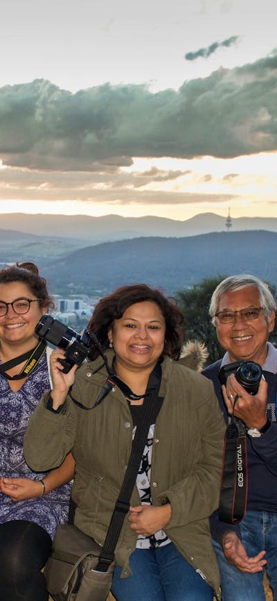 Smiling Capturing Canberra Photo group atop Mt Ainslie