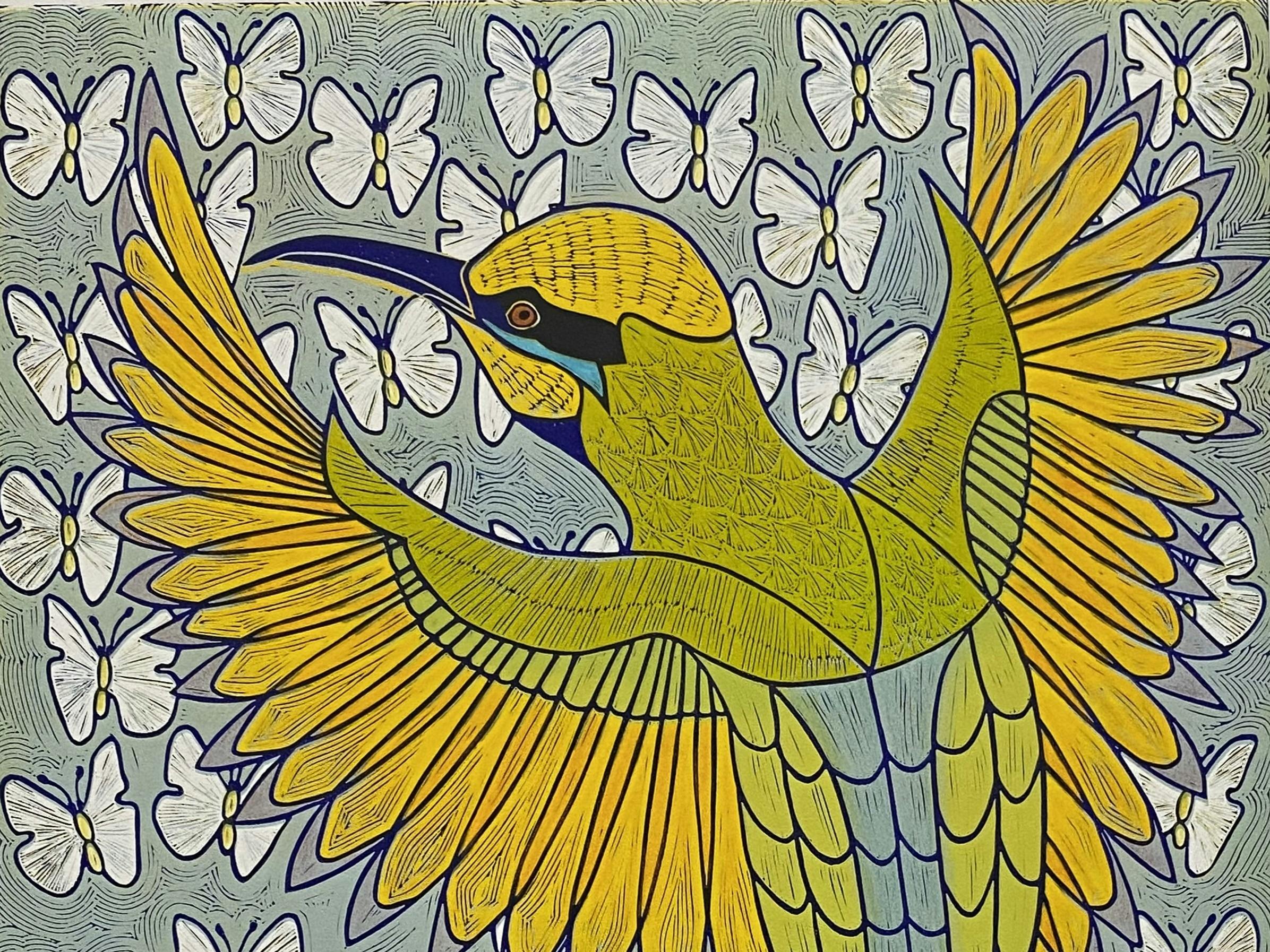 A print of a golden bird against a backdrop of butterflies.