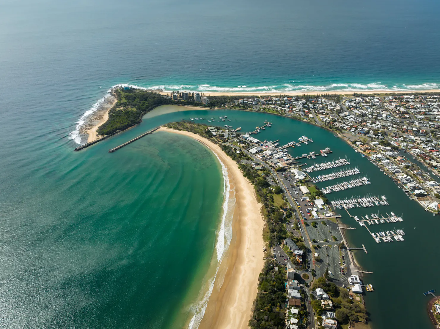 High arial shot of Mooloolaba showing the point, ocean and caravan park