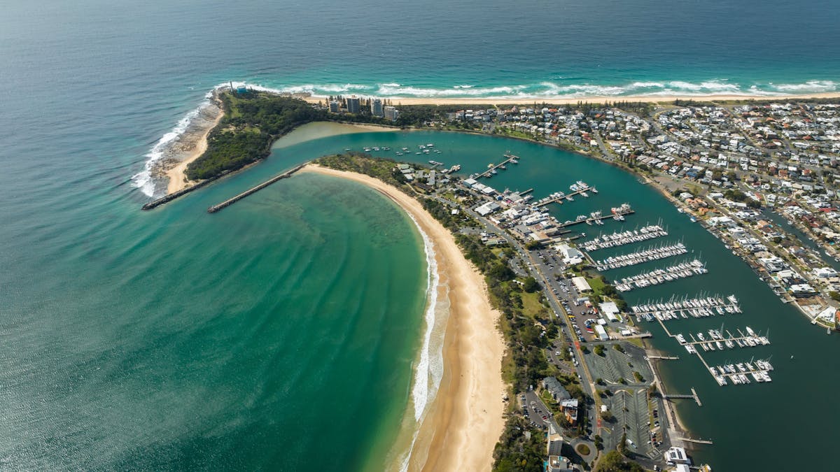 High arial shot of Mooloolaba showing the point, ocean and caravan park