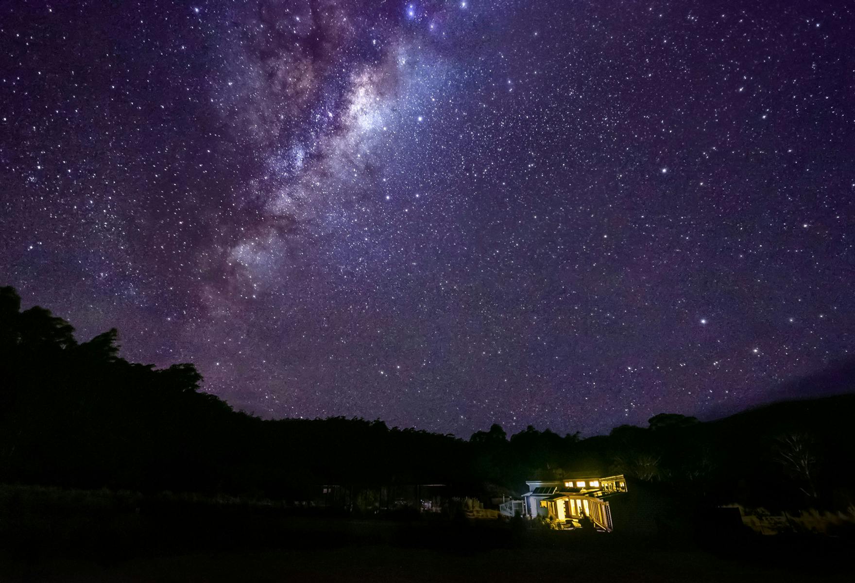 clear skys over forest Walks Lodge show many stars
