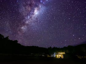 clear skys over forest Walks Lodge show many stars