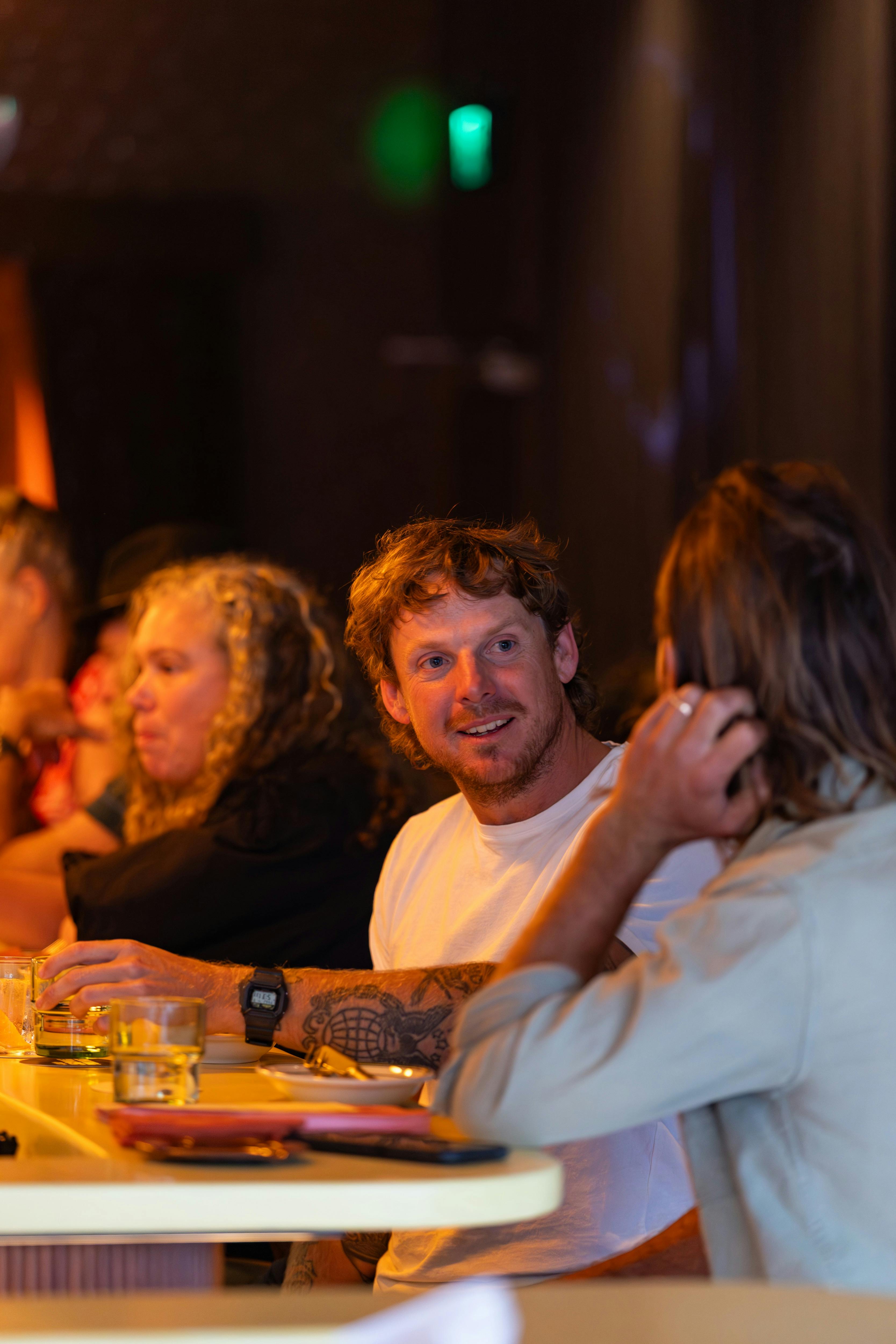 Friends meeting at the bar for drinks