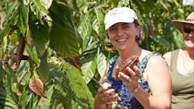 Woman with cocoa pod