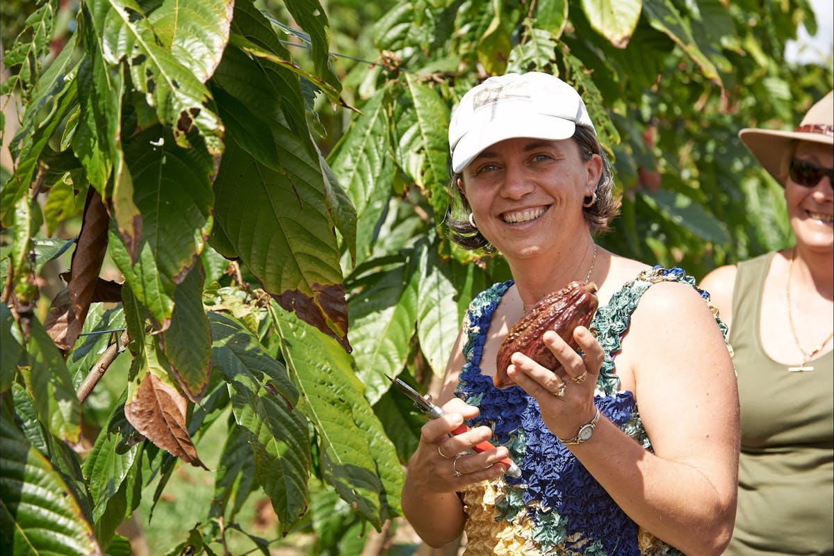 Woman with cocoa pod
