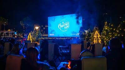 Outdoor cinema with fire pits and Christmas lights
