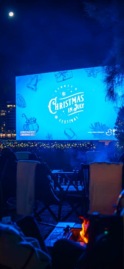 Outdoor cinema with fire pits and Christmas lights