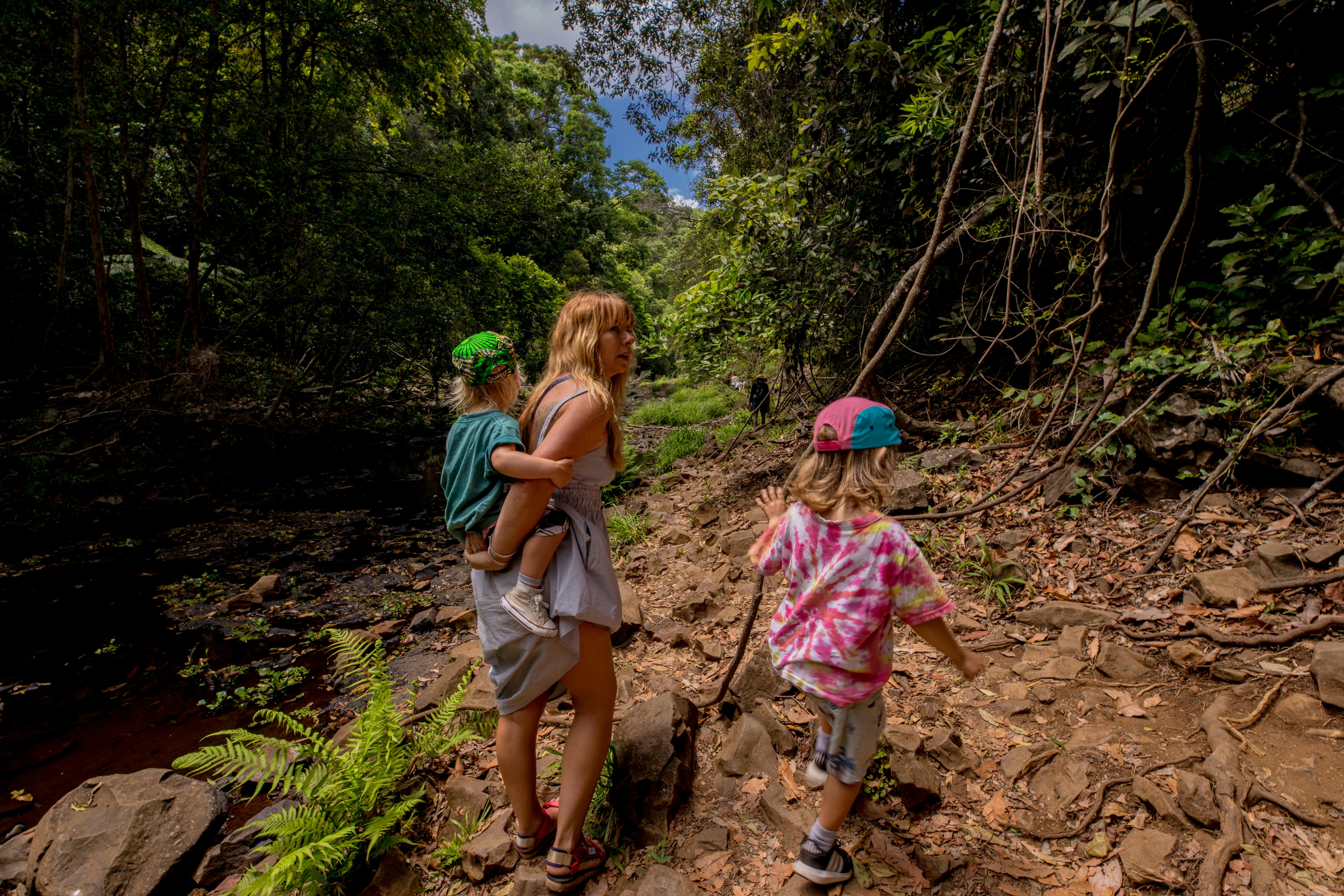 A mom with her kids in Chasing Waterfalls tour.