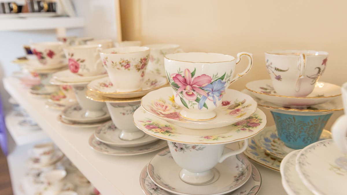 rows of vintage china trio tea cup sets