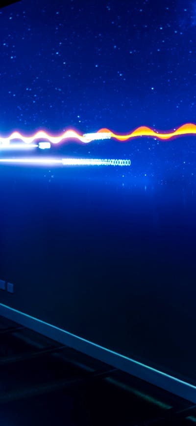 A young person interacting with Gravitational Weave at Outer Space