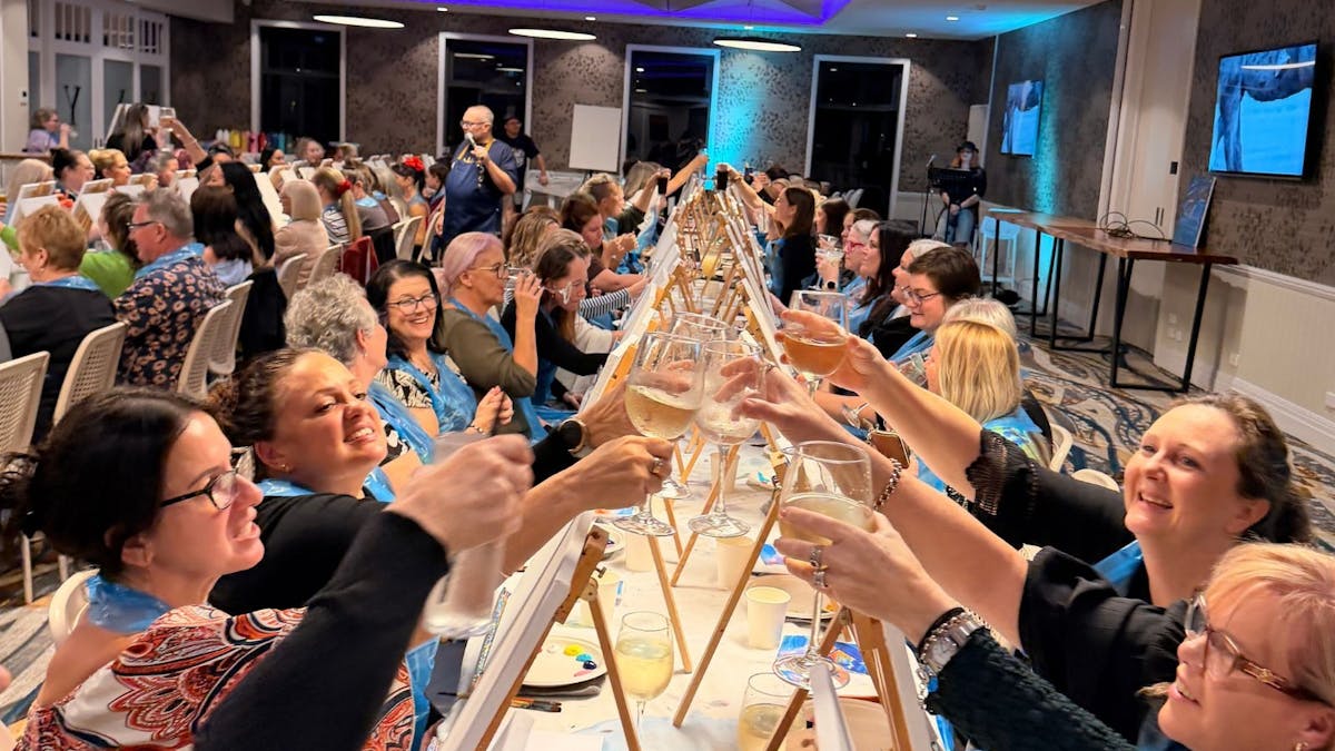 Paint Juicy customers cheering with wine glasses