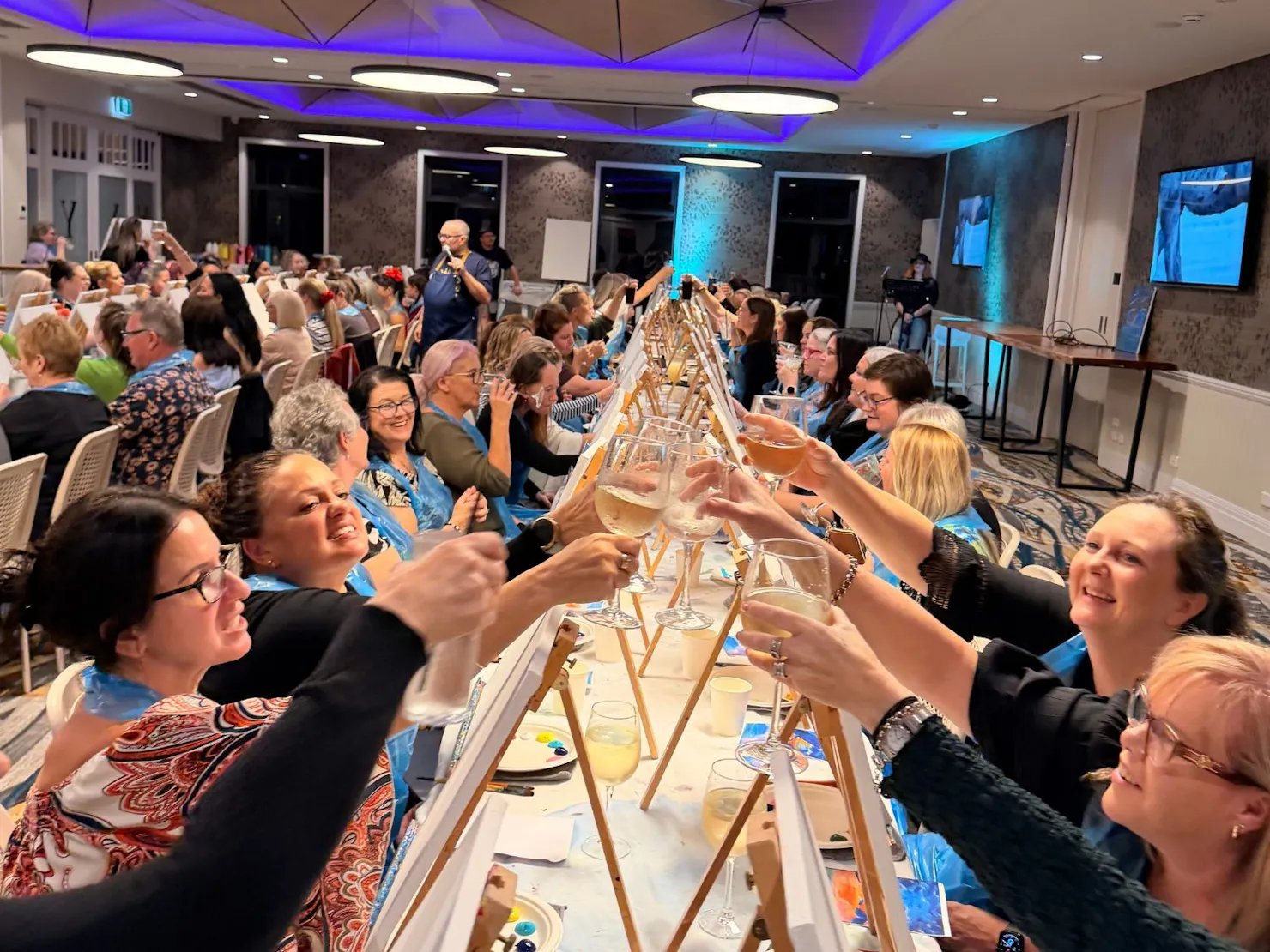 Paint Juicy customers cheering with wine glasses