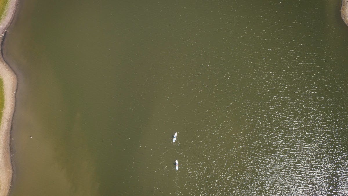 Two people Sup on Lake Callide