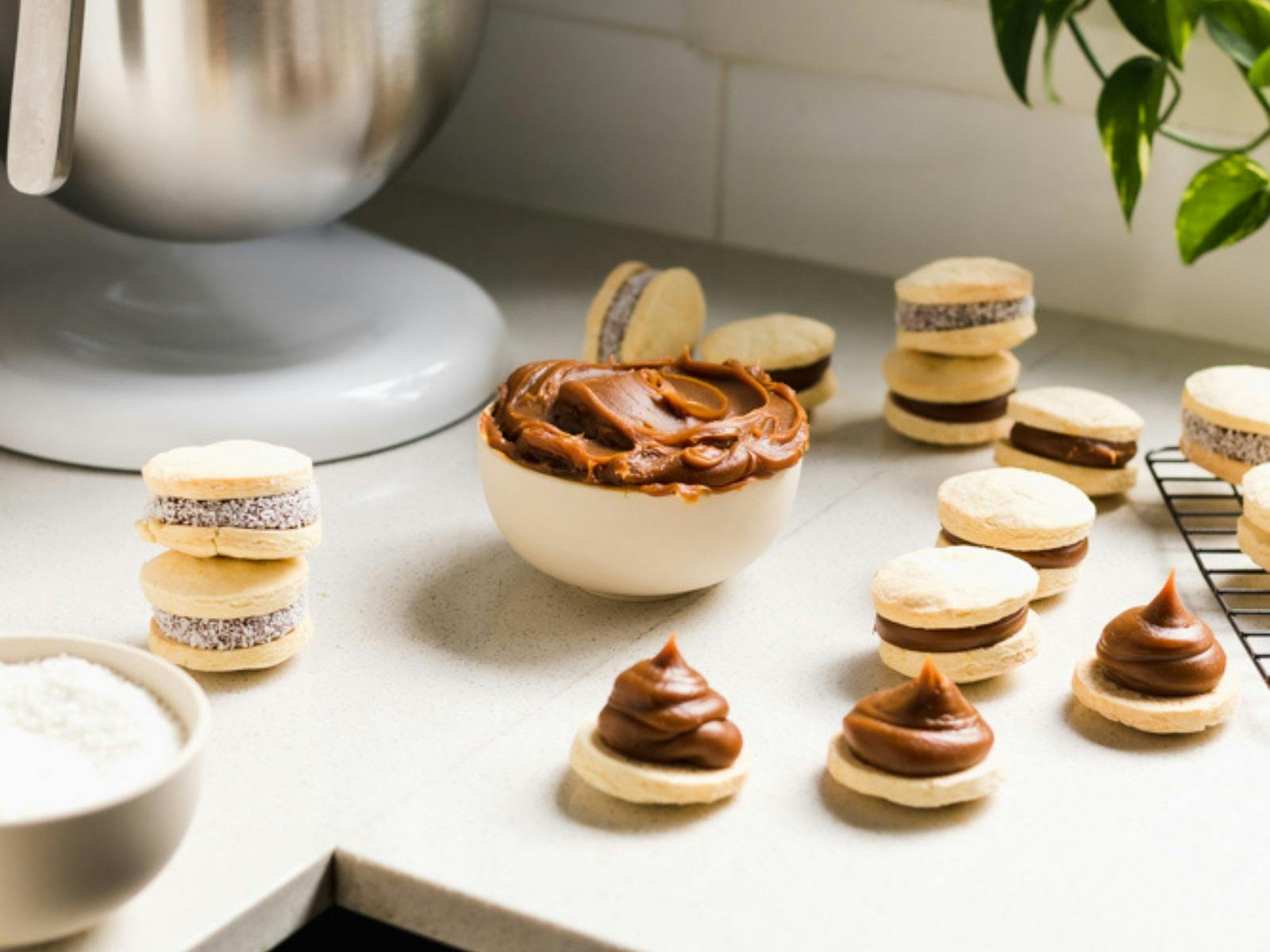 Alfajores on a white marble countertop