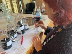 Women blending wine and making notes