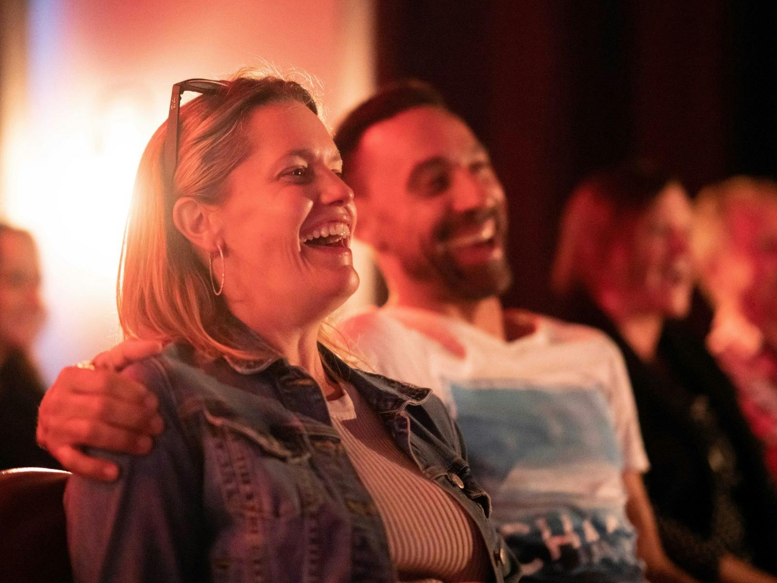 Couple laughing at comedy