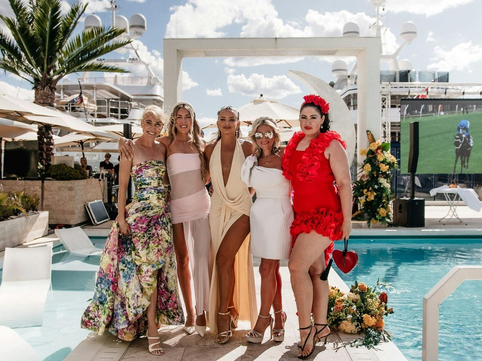 Ladies dressed up for the fashion on the field award at La Luna Beach Club.