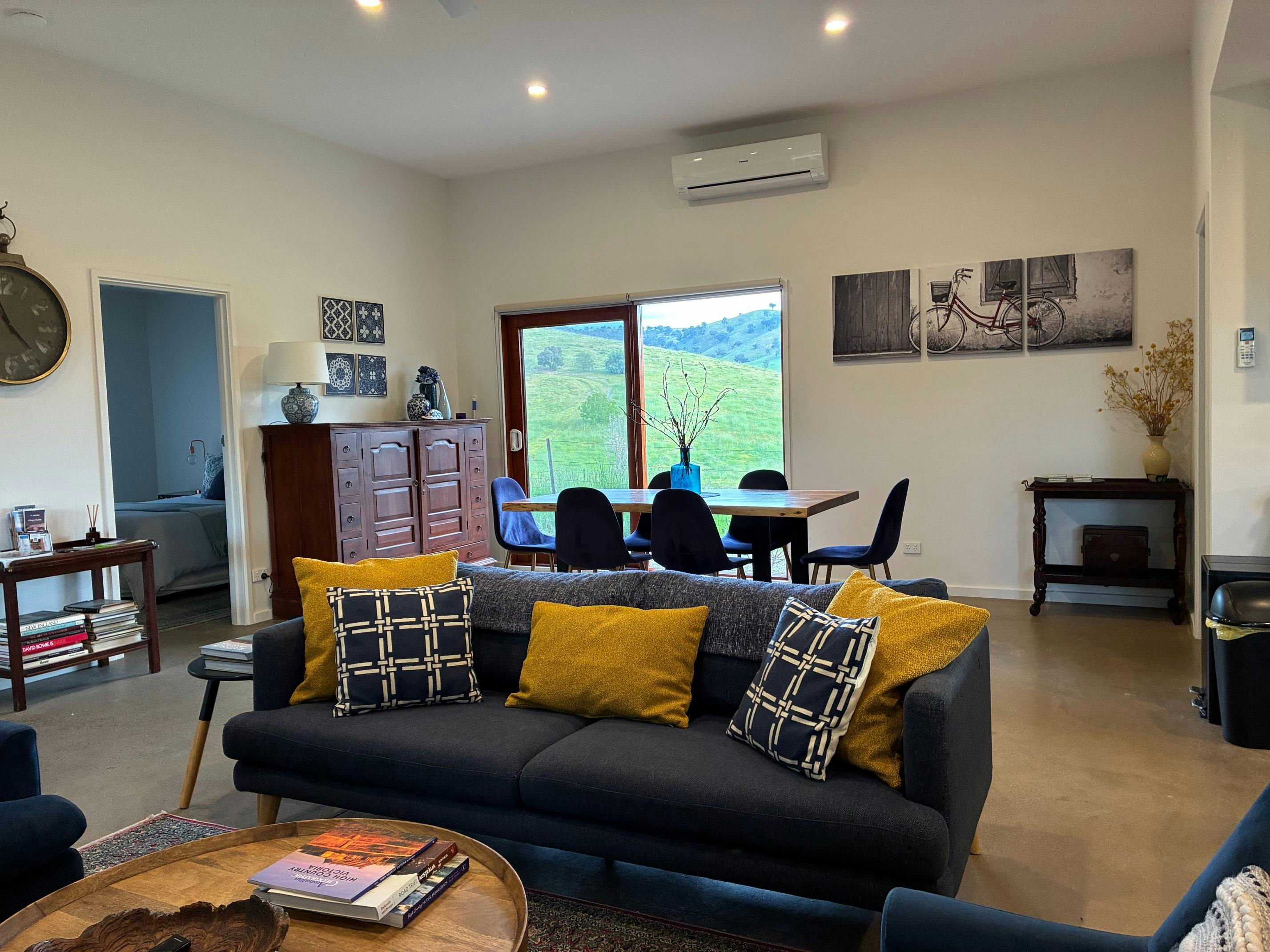 Omaroo Cottage living and dining room with views to the surrounding hills