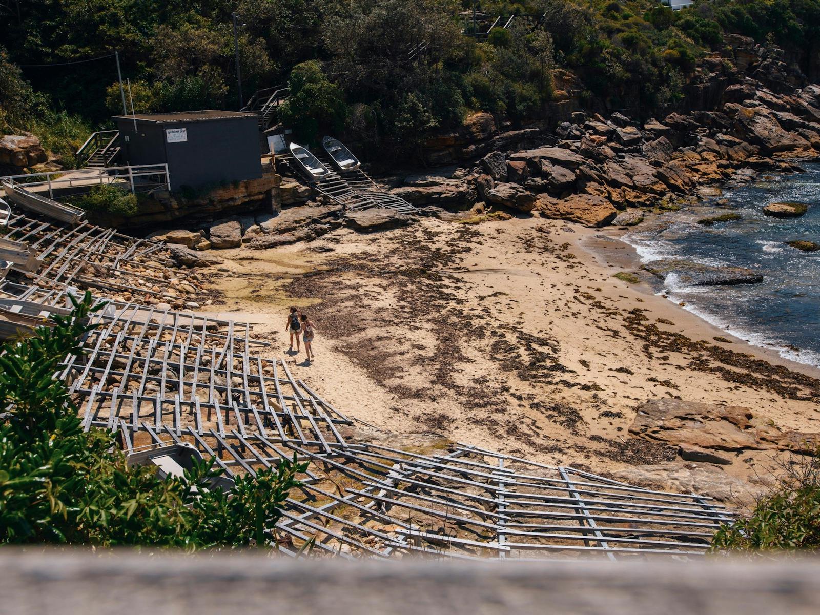 Women walking along the beach in Gordons Bay, Coogee