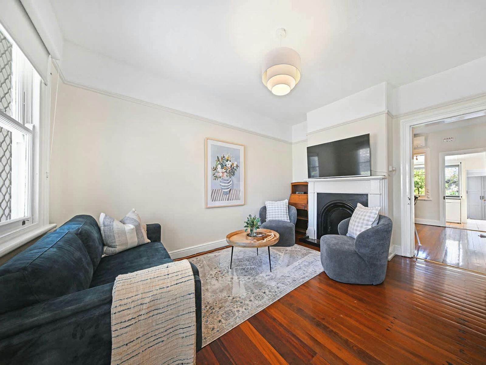 Front lounge with a couch and 2 armchairs